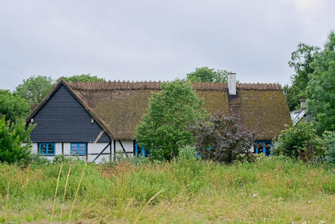 Flat Danish countryside with a red brick farmhouse