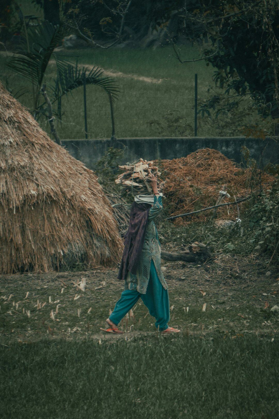 Photographer walking through a Danish village with camera bag