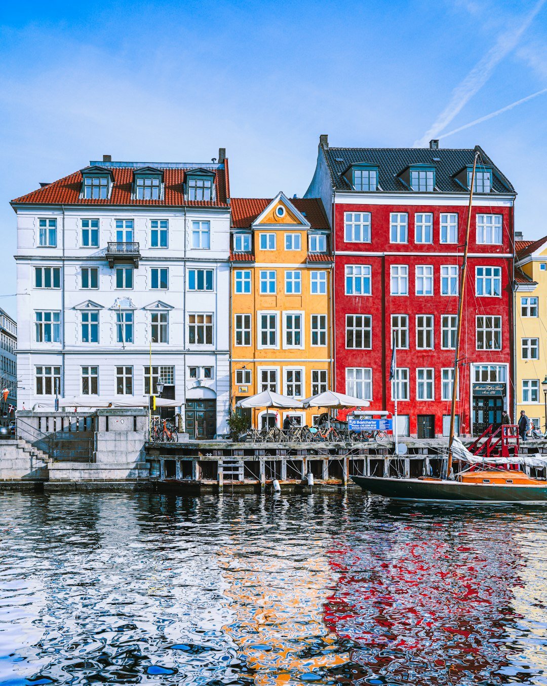 Colourful harbour houses in Nyhavn Copenhagen with boats