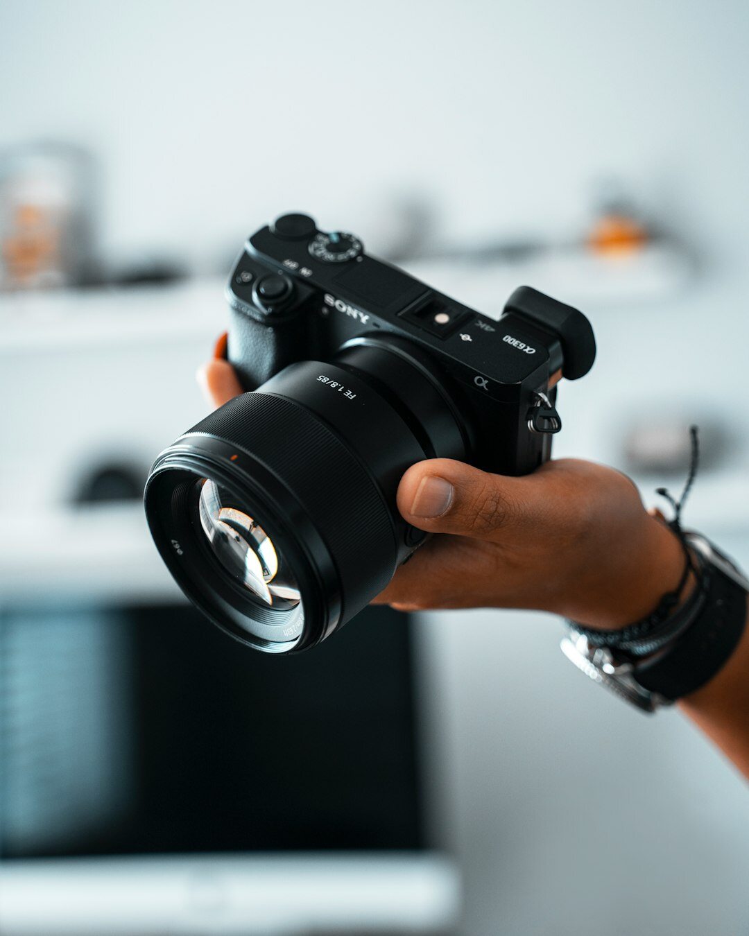 Danish documentary photographer holding a camera outdoors
